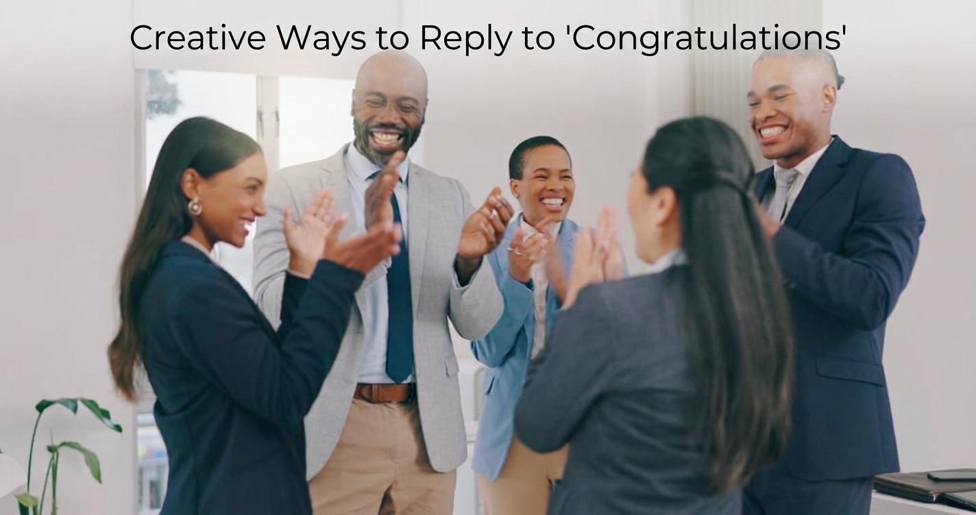 Colleagues in business attire smiling and clapping together in celebration.