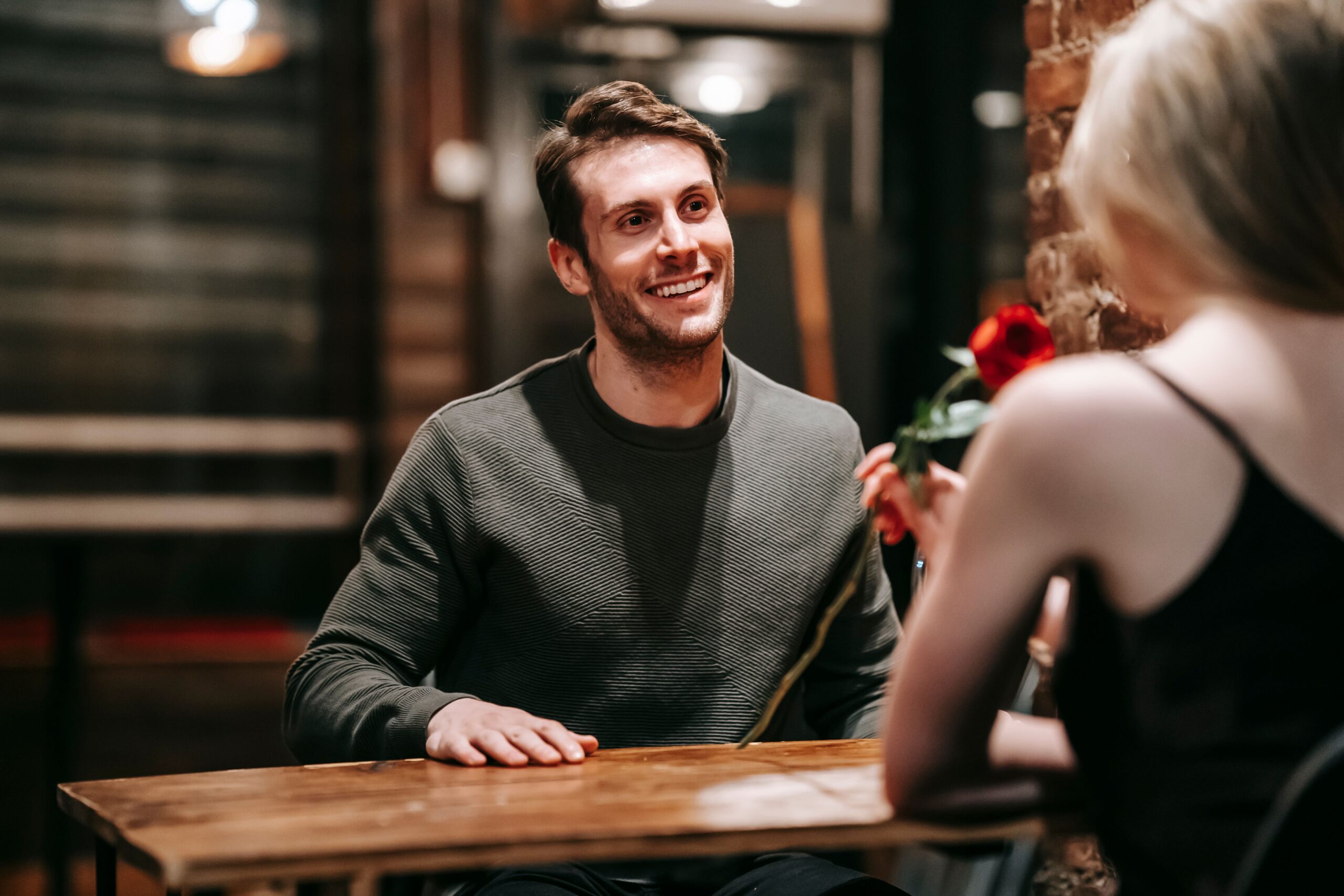 Woman smiling at her date revealing lifestyle compatibility on dating apps